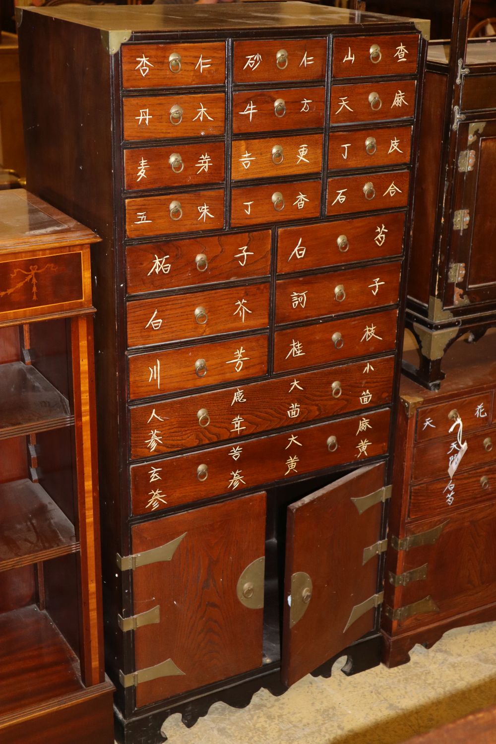 A pair of Chinese hardwood medicine chests, W.55cm, D.39cm., H.124cm